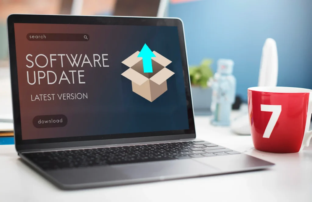 Laptop displaying a software update screen with an upload arrow and latest version message, representing updating laptop software to the newest version.