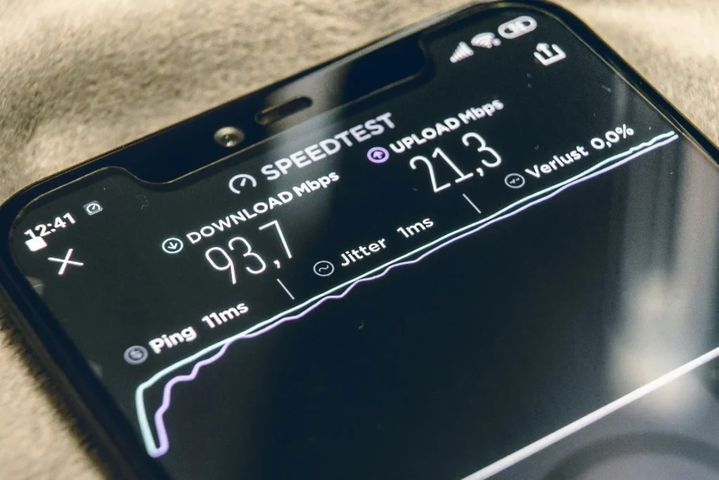 Smartphone displaying an internet speed test with NBN download and upload speeds