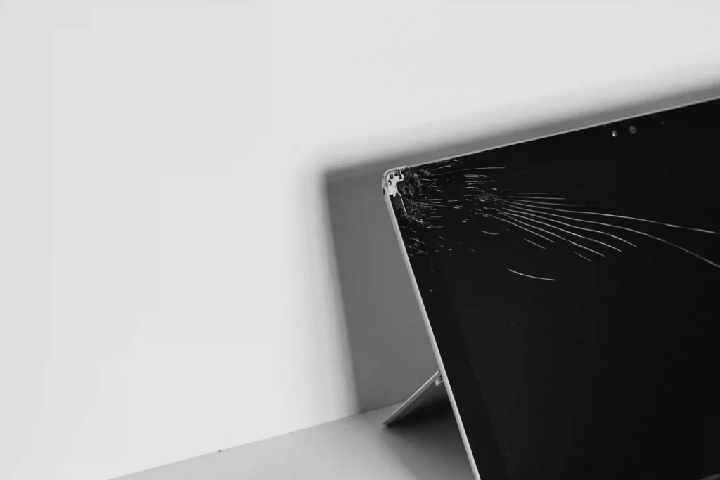 Cracked laptop display screen requiring hardware repair